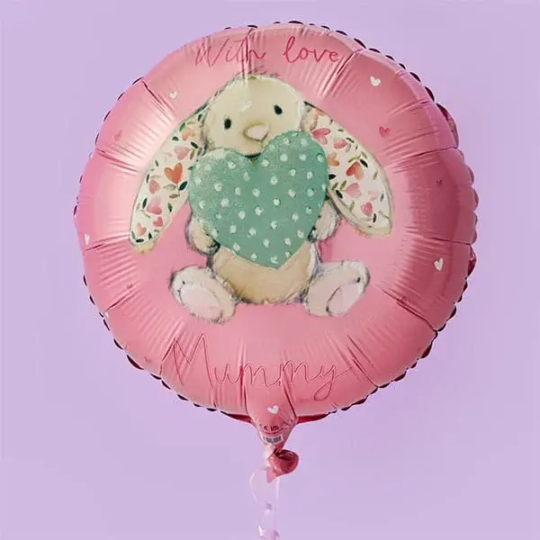 A pink round balloon featuring a cute bunny holding a teal heart with small white dots, decorated with tiny hearts and the words with love mummy.